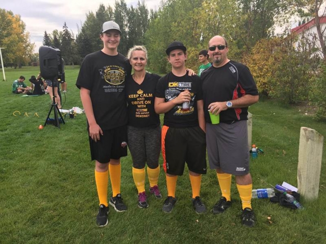 Ok Tire & Auto Service - owners celebrating in nature