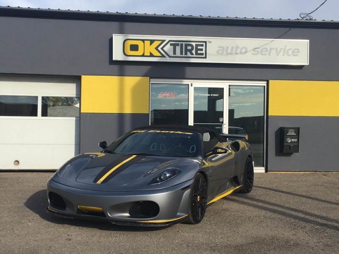 Ok Tire & Auto Service front with exotic car